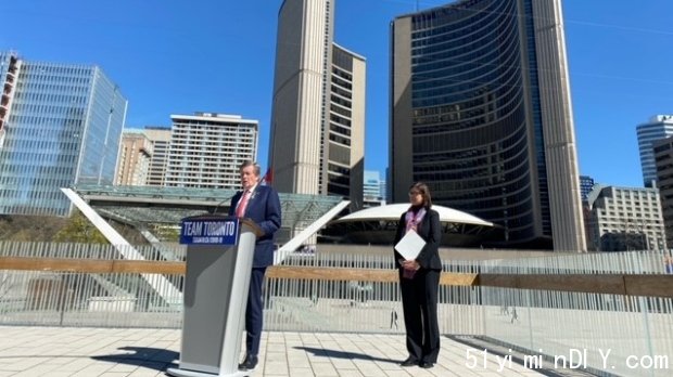 Mayor John Tory and Medical Officer of Health Dr. Eileen de Villa are shown outside Toronto City Hall on Monday. Tory has formally terminated a municipal state of emergency which had been in effect for a total of 777 days. 